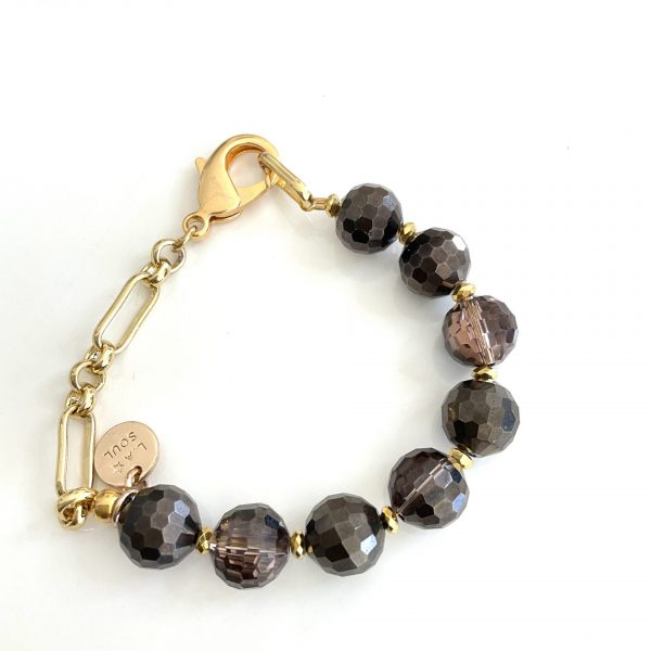 Bracelet doré perles de verre facettées marron